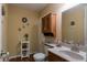 Charming bathroom with a pedestal sink, decorative accents, and a vanity cabinet at 1052 Barley Cir, Carmel, IN 46032