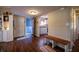 Inviting entryway with hardwood floors, built in bookshelves, and an open view to the kitchen at 1052 Barley Cir, Carmel, IN 46032