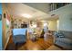 Spacious living room with hardwood floors, multiple sofas and view to second level landing at 1052 Barley Cir, Carmel, IN 46032