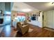 Open-concept living area features wood floors, built-in shelving, and an abundance of natural light at 1052 Barley Cir, Carmel, IN 46032