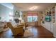 Bright and spacious living room featuring hardwood floors, built-in shelving, and fireplace at 1052 Barley Cir, Carmel, IN 46032