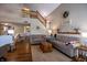 Bright and open living room with hardwood floors, comfortable sofas, and natural light from second story at 1052 Barley Cir, Carmel, IN 46032