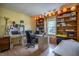 Comfortable home office with built-in shelving, natural light, and ample workspace at 1052 Barley Cir, Carmel, IN 46032