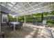 Outdoor patio area featuring a white pergola, neutral patio set, and backyard views at 1052 Barley Cir, Carmel, IN 46032