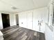 Open bonus room with hardwood style flooring and ample natural light at 106 S Hancock St, Waynetown, IN 47990