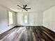 Freshly painted room with modern ceiling fan and vinyl wood-look floors, ready to be personalized at 106 S Hancock St, Waynetown, IN 47990