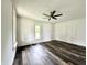 Clean, bright room with ceiling fan, and wood-look floors, providing a versatile living space at 106 S Hancock St, Waynetown, IN 47990