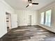 Bright and airy living room with lots of natural light and rich wood-look vinyl plank flooring at 106 S Hancock St, Waynetown, IN 47990