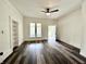 Inviting living room with sleek floors, built in shelving, and ample light from double-paned windows at 106 S Hancock St, Waynetown, IN 47990