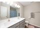 Bright bathroom featuring a double sink vanity, shower with patterned curtain, and neutral wall color at 1065 Bent Branch Ln, Greenwood, IN 46143