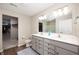Bathroom featuring double vanity sinks with a walk-in closet at 1065 Bent Branch Ln, Greenwood, IN 46143
