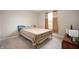 Cozy bedroom with neutral carpeting, natural light, and basic furnishings at 1065 Bent Branch Ln, Greenwood, IN 46143