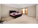 Bedroom featuring tray ceilings, neutral carpeting, and furnishings at 1065 Bent Branch Ln, Greenwood, IN 46143