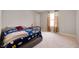 Cozy bedroom featuring neutral carpeting, window views, and simple furnishings at 1065 Bent Branch Ln, Greenwood, IN 46143