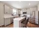 Modern kitchen featuring stainless steel appliances, white countertops, an island with seating, and ample cabinet space at 1065 Bent Branch Ln, Greenwood, IN 46143