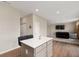 Bright open concept kitchen with stainless steel appliances and eat-in island at 1065 Bent Branch Ln, Greenwood, IN 46143