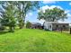 Expansive backyard featuring a lush lawn and a play area for , perfect for outdoor activities at 10854 E 700 N, Wilkinson, IN 46186