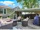 Backyard with a cozy covered deck area, perfect for outdoor relaxation and entertaining in a serene setting at 10854 E 700 N, Wilkinson, IN 46186