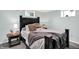 Comfortable bedroom featuring a stylish black bed frame, neutral bedding, and tasteful decor for a relaxing retreat at 10854 E 700 N, Wilkinson, IN 46186