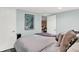 Relaxing bedroom with a well-made bed, soft pillows, an open door, and wall decor for a welcoming atmosphere at 10854 E 700 N, Wilkinson, IN 46186