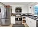 Stainless steel appliances and white cabinets in updated kitchen at 10854 E 700 N, Wilkinson, IN 46186