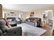 Spacious living room with neutral walls, plush seating, and elegant area rug on hardwood floors at 10854 E 700 N, Wilkinson, IN 46186