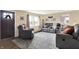 Inviting living room with comfortable seating, large window, and hardwood floors with stylish rug at 10854 E 700 N, Wilkinson, IN 46186