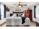 Cozy main bedroom with natural light, ceiling fan and hardwood floors at 10854 E 700 N, Wilkinson, IN 46186