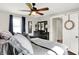 Comfortable main bedroom with natural light, ceiling fan and decor at 10854 E 700 N, Wilkinson, IN 46186