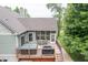Beautiful back deck with a hot tub, grill, outdoor seating and a screened-in porch for outdoor entertaining at 11020 Florida Rd, Fortville, IN 46040