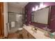 Bathroom with a large vanity, a tiled shower and a decorative mirror at 11020 Florida Rd, Fortville, IN 46040