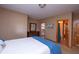 Comfortable bedroom with a dresser, closet, and access to the ensuite bathroom at 11020 Florida Rd, Fortville, IN 46040