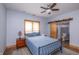Bright bedroom with a ceiling fan, natural light, and ensuite bathroom with sliding barn door at 11020 Florida Rd, Fortville, IN 46040