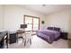 Bedroom featuring a bright window, study desk, and comfortable bed at 11020 Florida Rd, Fortville, IN 46040