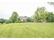 Charming home featuring well-maintained lawn and mature trees at 11020 Florida Rd, Fortville, IN 46040