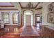 Inviting foyer with hardwood floors, a stylish rug, and a view of the home's entrance and interior at 11020 Florida Rd, Fortville, IN 46040