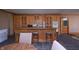 Entertainers kitchen with barstool seating, cabinets, and appliances at 11020 Florida Rd, Fortville, IN 46040