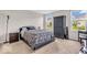 A neutral-toned bedroom with a bed, wardrobe, and natural light at 123 Campus Ln, Greenwood, IN 46143