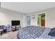 Bedroom featuring a bed, television, and walk-in closet entrance at 123 Campus Ln, Greenwood, IN 46143
