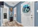 Entryway featuring a white door with a wreath and views into the home at 123 Campus Ln, Greenwood, IN 46143