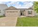 Charming single-Gathering home featuring a 2-car garage and well-maintained lawn at 123 Campus Ln, Greenwood, IN 46143