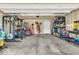 The spacious garage offers ample space for storage and projects with a high ceiling and concrete floors at 123 Campus Ln, Greenwood, IN 46143