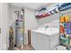 This laundry room features a water heater, washer and dryer, and wire rack shelving for storage at 123 Campus Ln, Greenwood, IN 46143