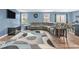 A spacious living room with hardwood floors and a large sectional sofa at 123 Campus Ln, Greenwood, IN 46143