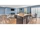 Open floor plan features kitchen island, dining area, and cozy living room with ample natural light at 123 Campus Ln, Greenwood, IN 46143