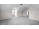 Finished attic space featuring neutral color scheme, carpet, and a window with natural light at 12383 S 25 W, Columbus, IN 47201