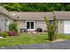 Backyard with a firepit, patio, and well-maintained lawn offering a cozy outdoor retreat at 12383 S 25 W, Columbus, IN 47201