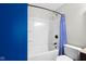 Bathroom featuring a shower and tub combination with a blue patterned shower curtain at 12383 S 25 W, Columbus, IN 47201