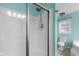 Bathroom featuring a modern shower with updated fixtures and clean, bright tile and blue walls at 12383 S 25 W, Columbus, IN 47201