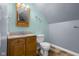 Bright bathroom featuring oak vanity, coordinated walls, and an elegant mirror with vanity lighting at 12383 S 25 W, Columbus, IN 47201